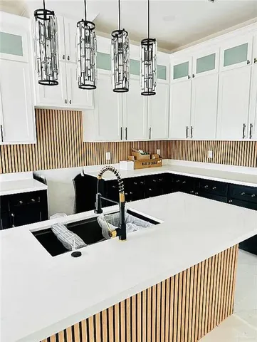 a living room with a table chairs and a wooden floor