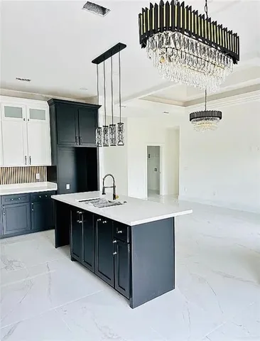 a kitchen with a sink a cabinets and window