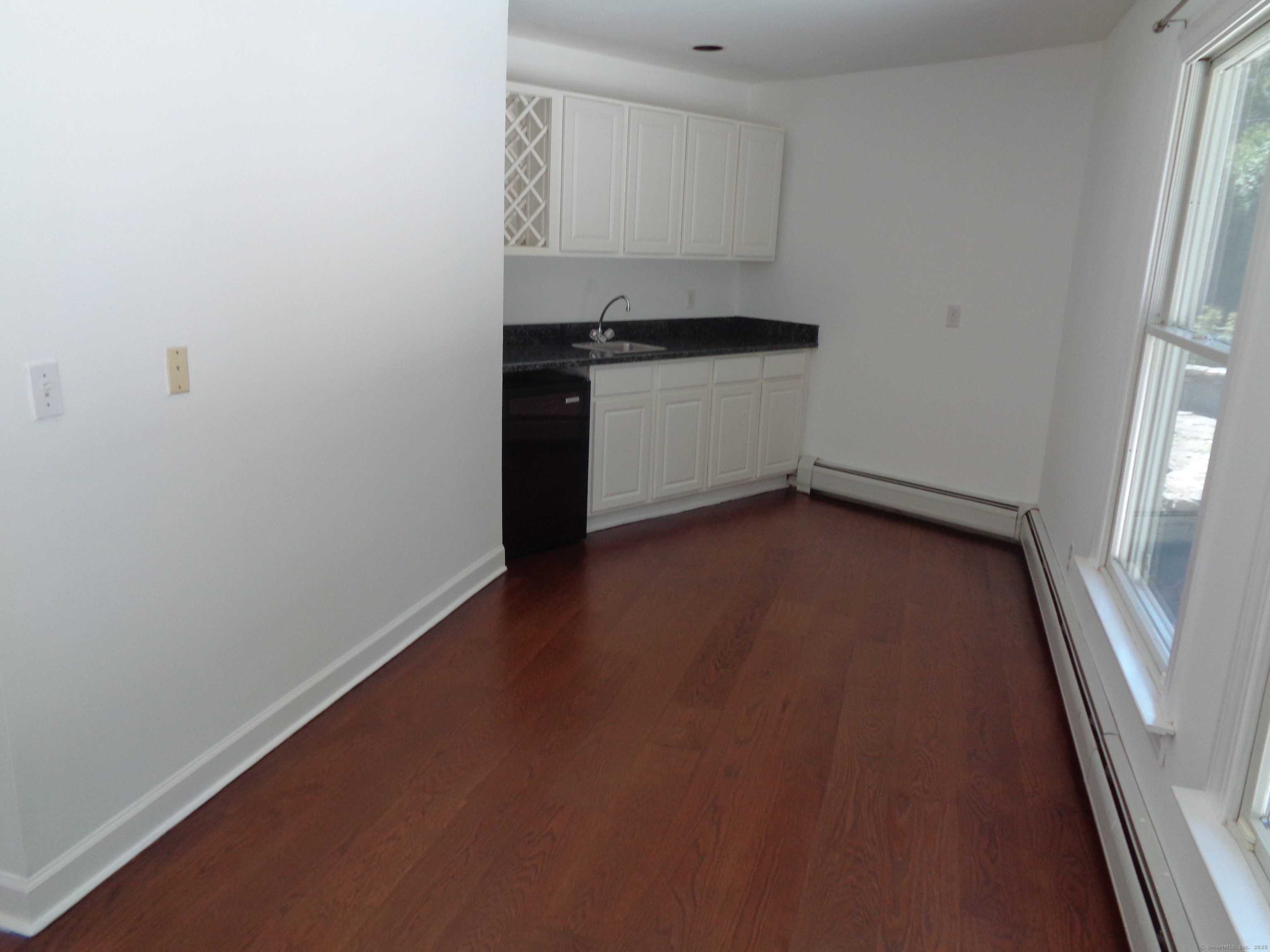 531 Hollow Tree Ridge Road Darien, CT 06820 - Photo 13 of 37 a view of a kitchen with a sink and a stove