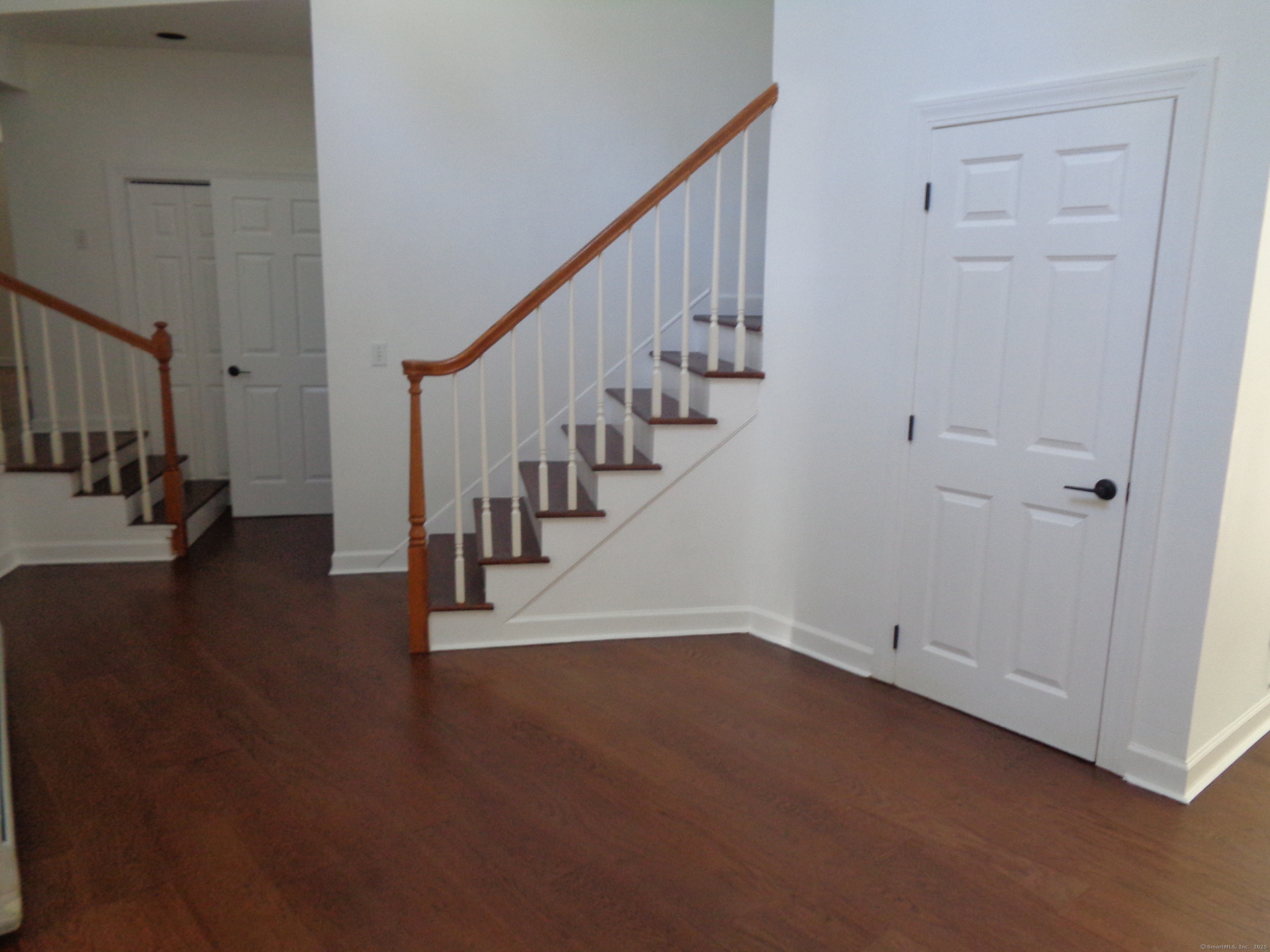 531 Hollow Tree Ridge Road Darien, CT 06820 - Photo 16 of 37 a view of entryway and hall with wooden floor