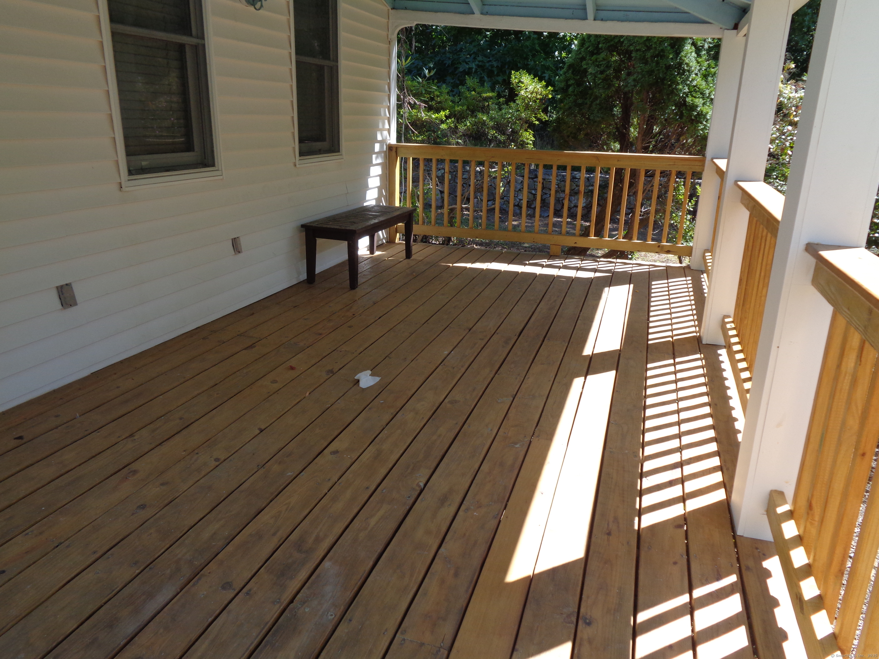 531 Hollow Tree Ridge Road Darien, CT 06820 - Photo 8 of 37 a view of deck with wooden floor and seating space