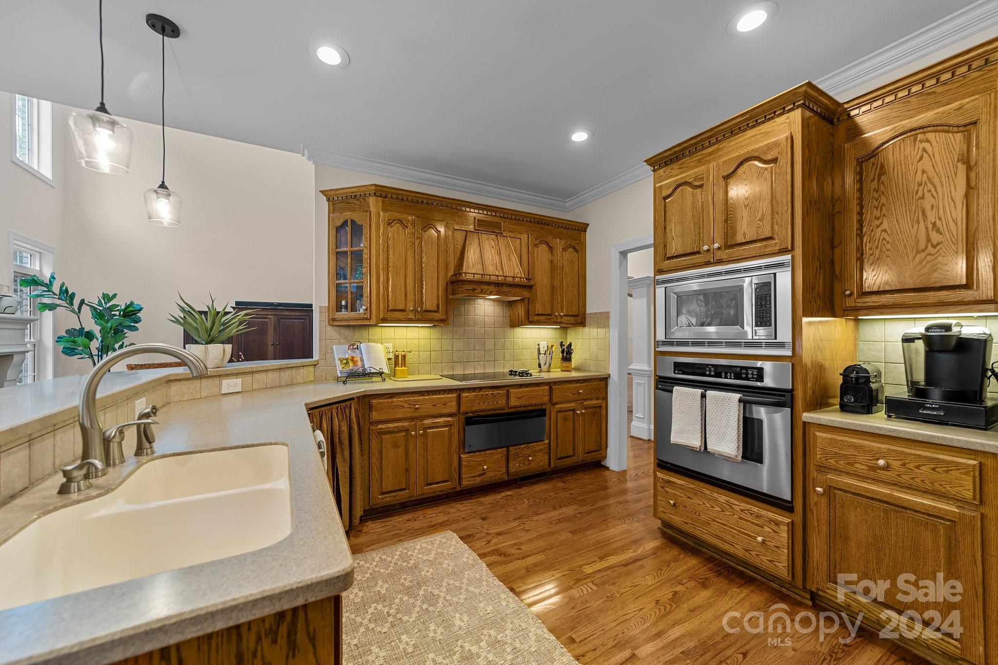 6370 Chamar Circle Kannapolis, NC 28081 - Photo 16 of 48 a kitchen with stainless steel appliances granite countertop a sink stove and refrigerator
