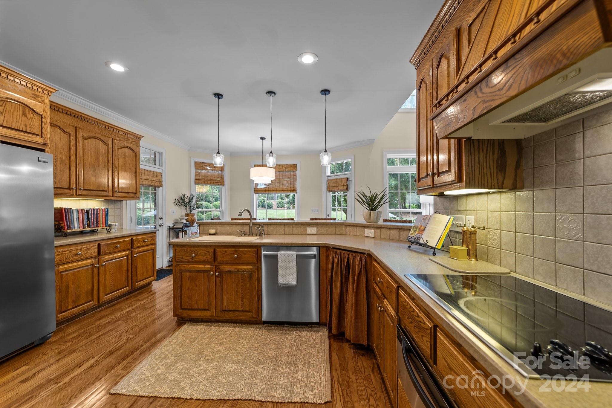 6370 Chamar Circle Kannapolis, NC 28081 - Photo 17 of 48 a kitchen with stainless steel appliances granite countertop a sink stove and refrigerator