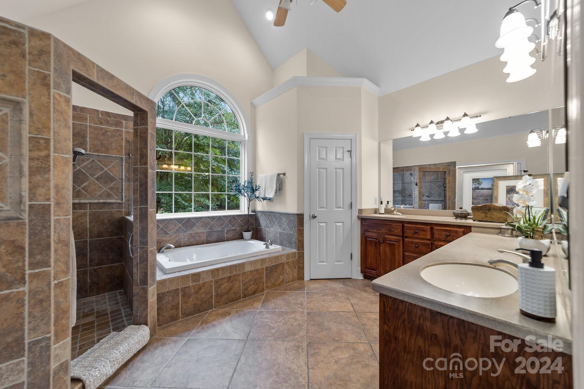 6370 Chamar Circle Kannapolis, NC 28081 - Photo 20 of 48 a bathroom with a sink a toilet a mirror and window