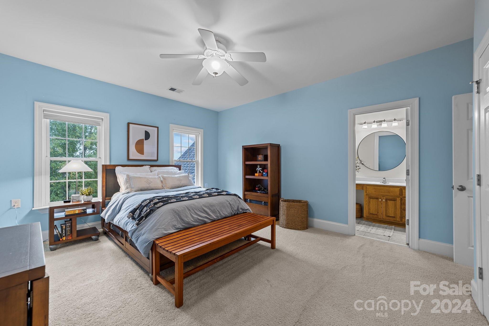 6370 Chamar Circle Kannapolis, NC 28081 - Photo 24 of 48 a spacious bedroom with a bed and a chandelier
