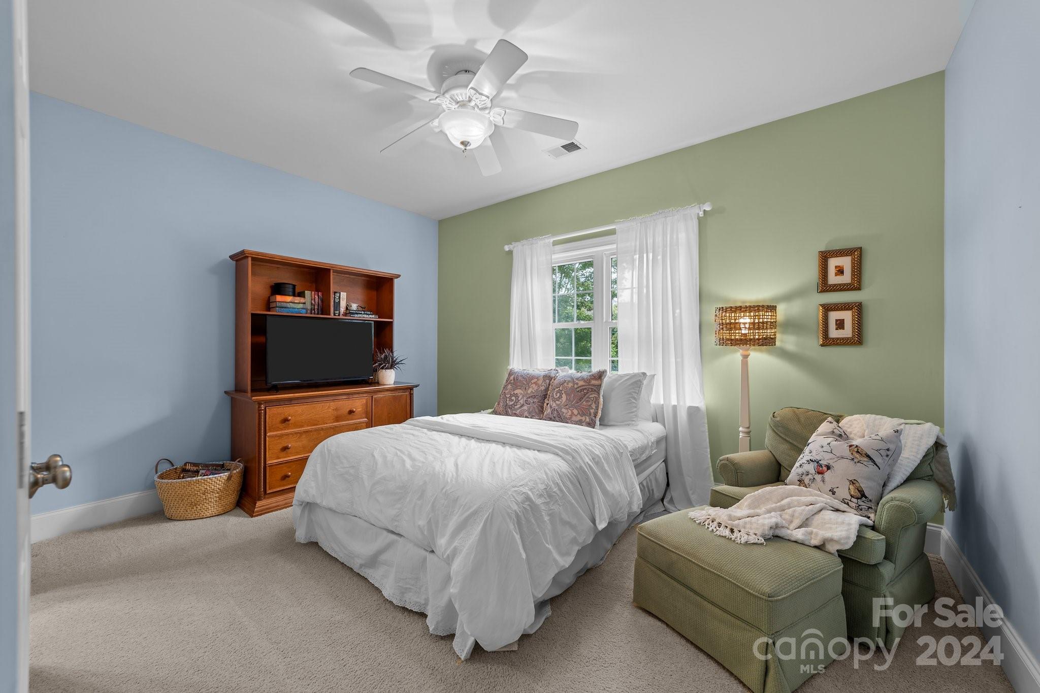 6370 Chamar Circle Kannapolis, NC 28081 - Photo 26 of 48 a bedroom with a bed and a flat screen tv