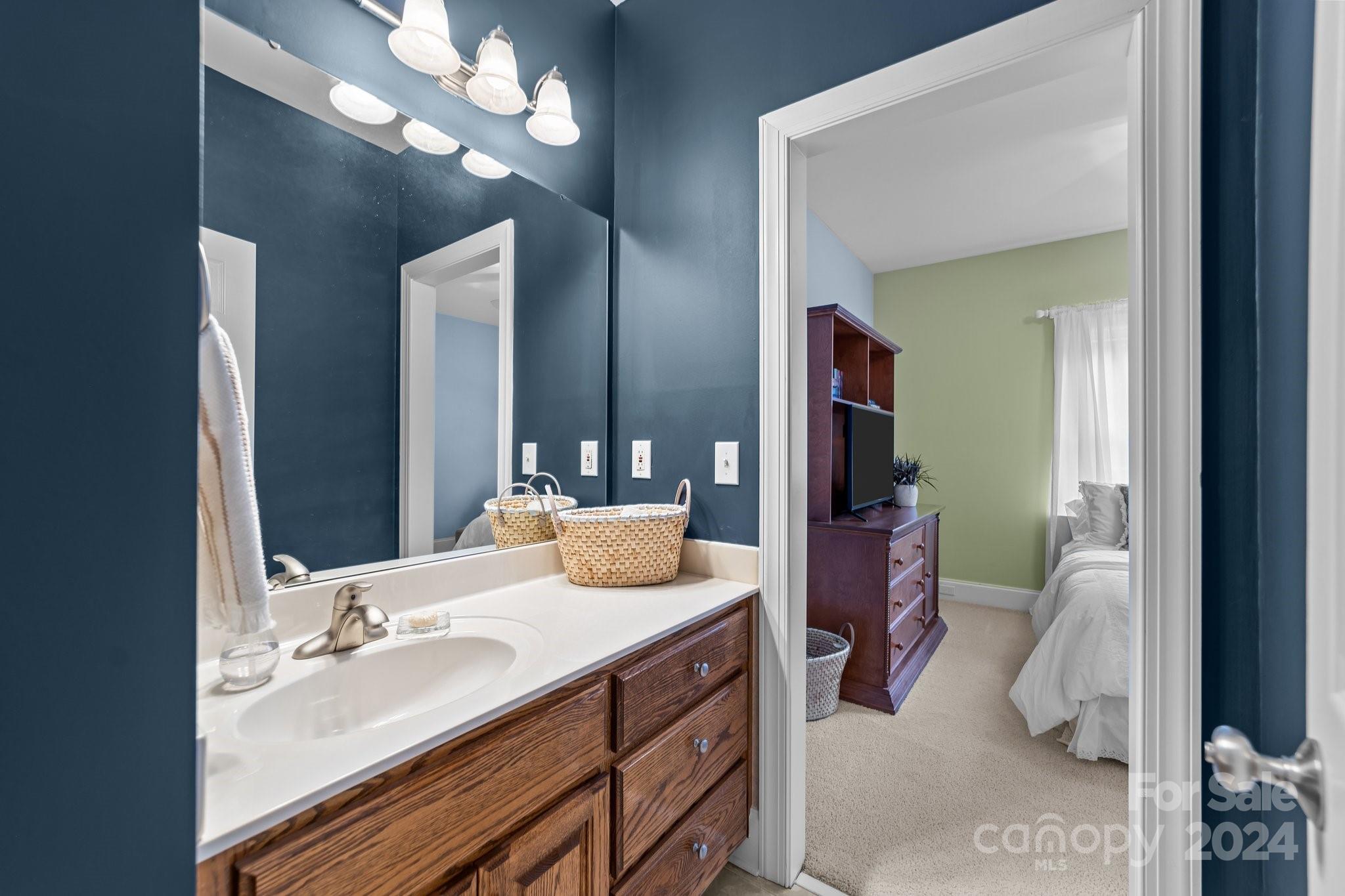 6370 Chamar Circle Kannapolis, NC 28081 - Photo 27 of 48 a en suite bathroom with a double vanity sink and a mirror