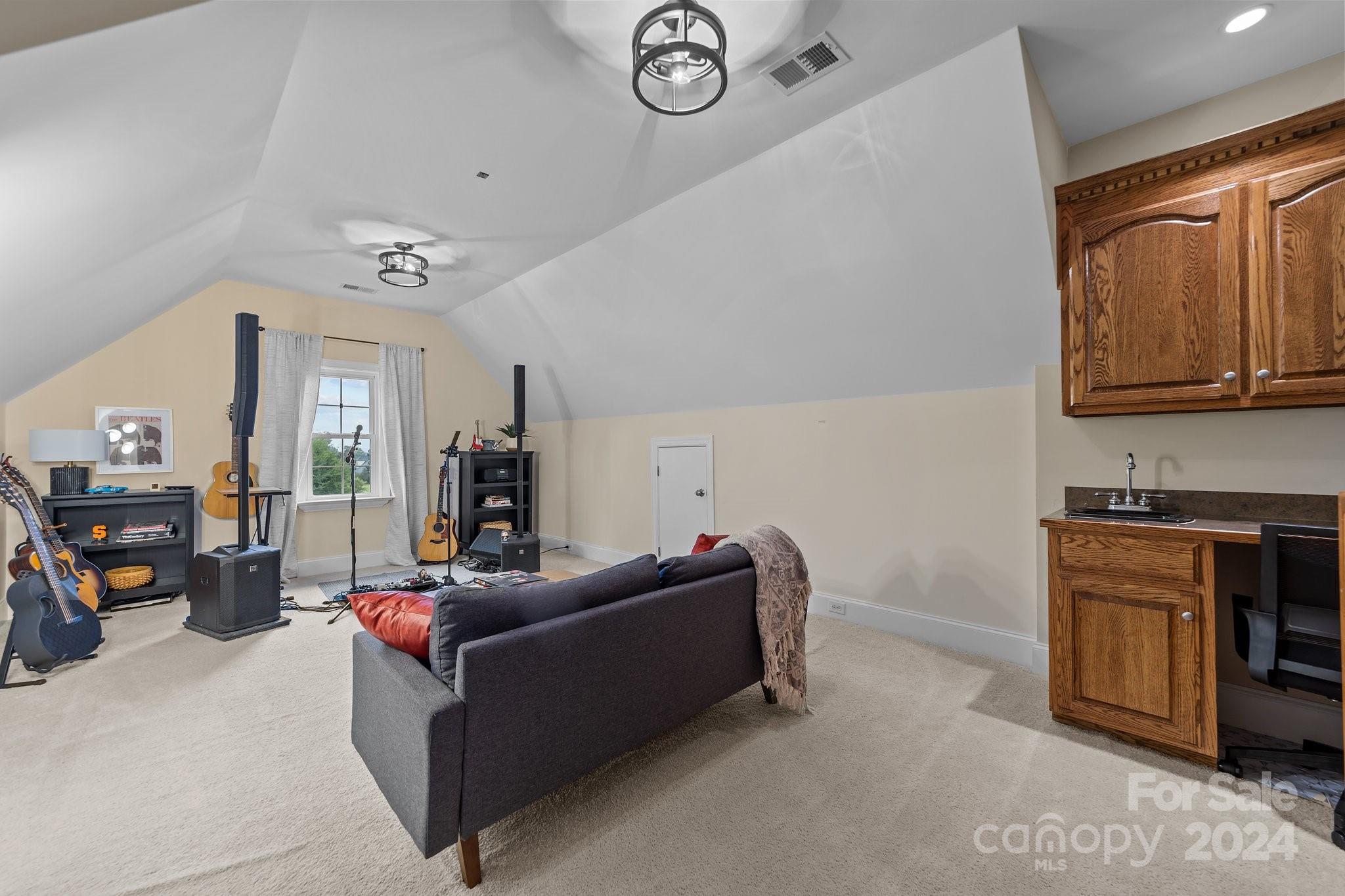 6370 Chamar Circle Kannapolis, NC 28081 - Photo 30 of 48 a living room with furniture a clock and a window