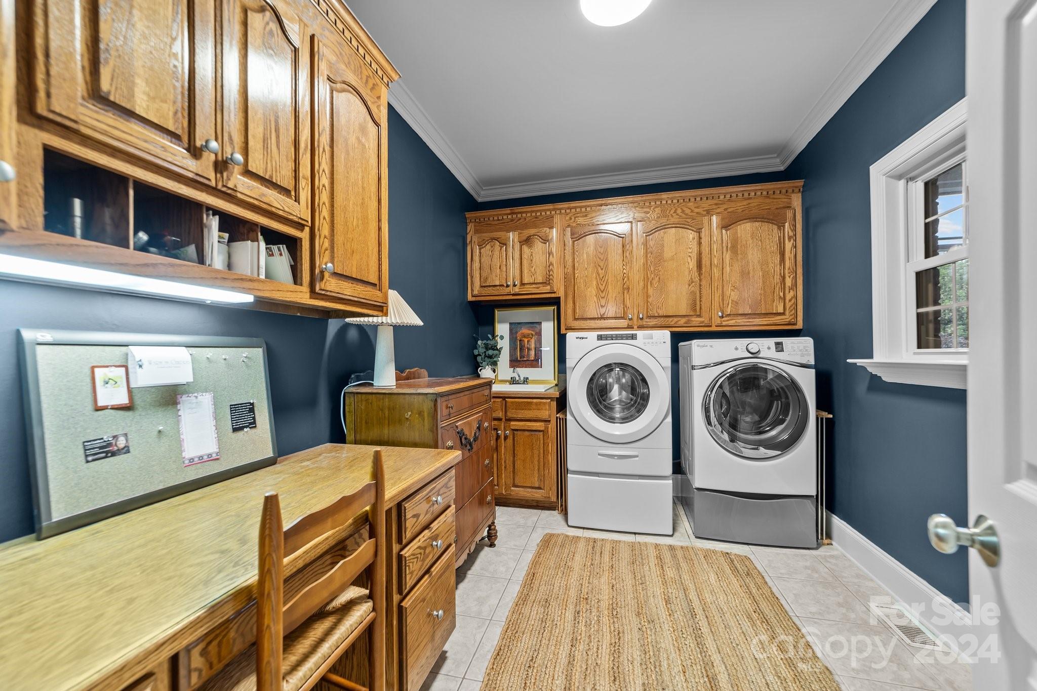 6370 Chamar Circle Kannapolis, NC 28081 - Photo 32 of 48 a utility room with dryer washer and a view of kitchen