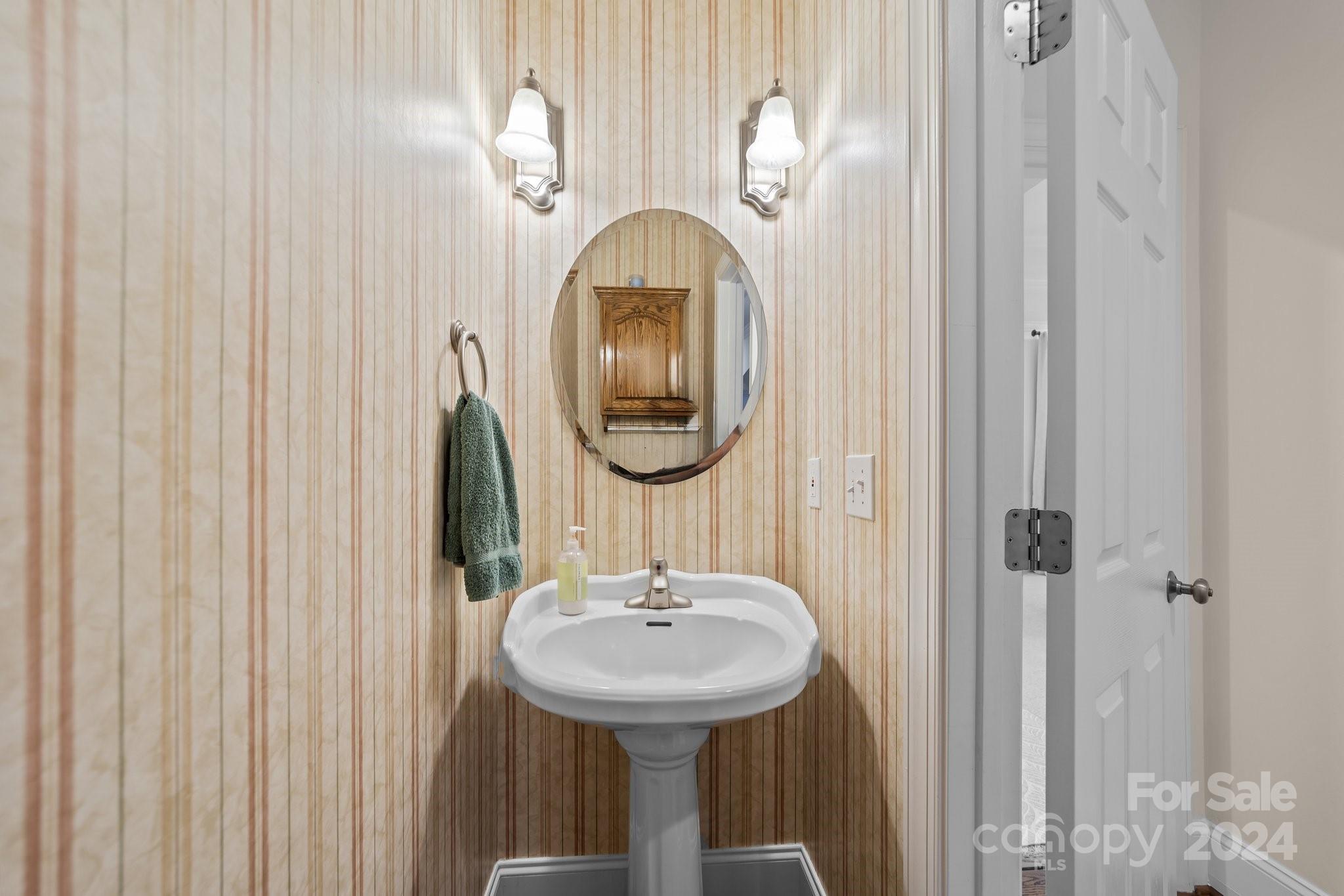 6370 Chamar Circle Kannapolis, NC 28081 - Photo 33 of 48 a bathroom with a sink and a mirror