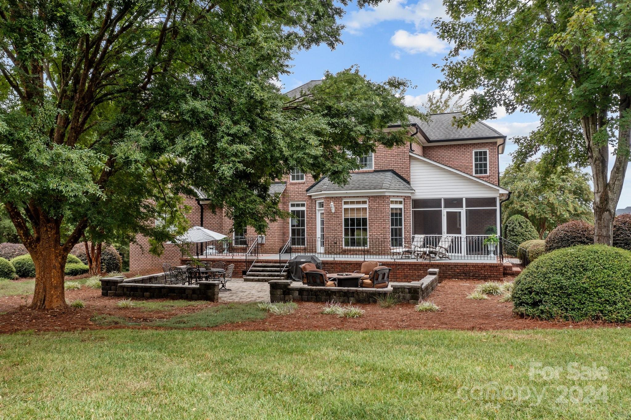 6370 Chamar Circle Kannapolis, NC 28081 - Photo 35 of 48 a front view of a house with a yard table and chairs