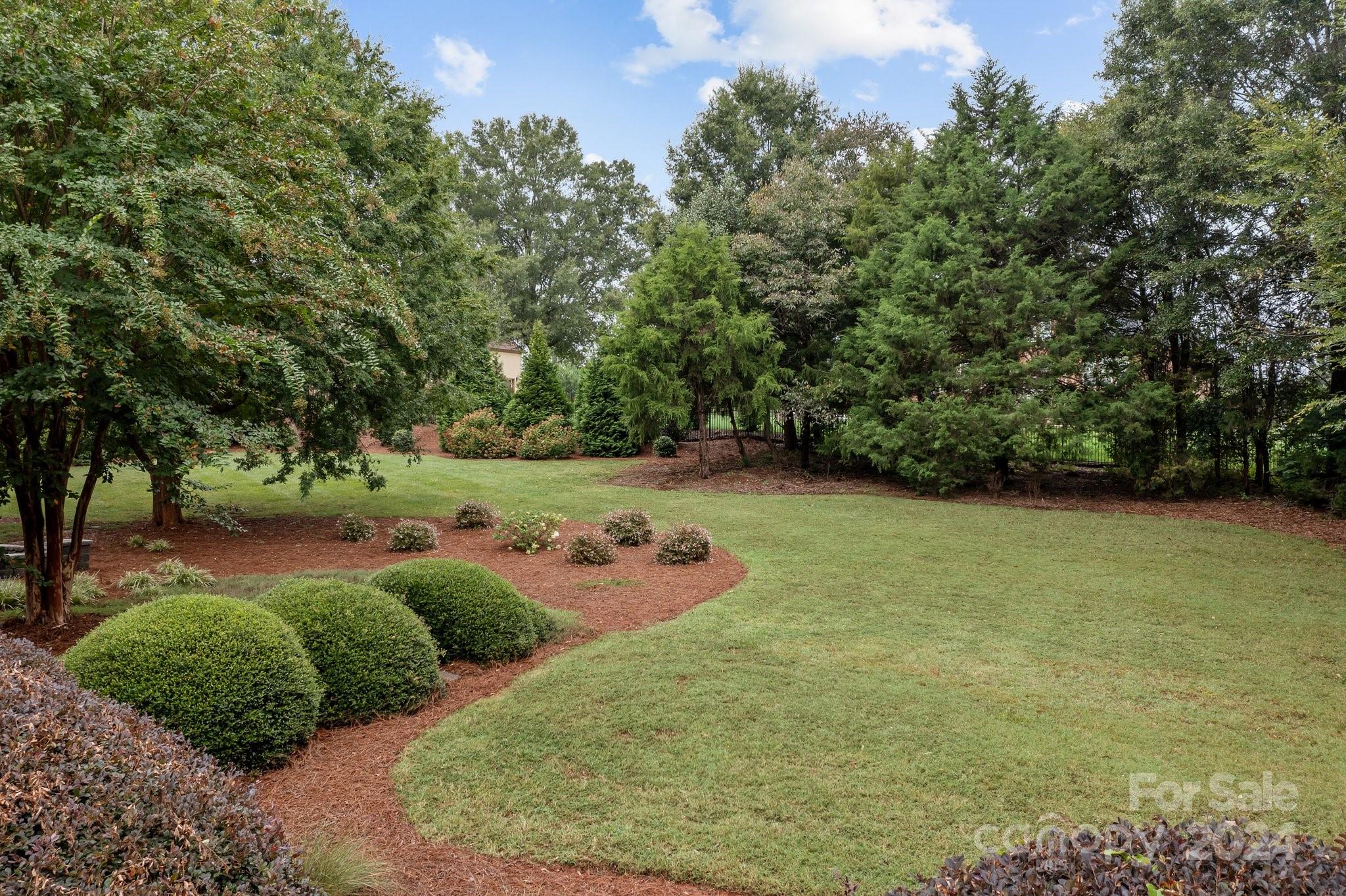 6370 Chamar Circle Kannapolis, NC 28081 - Photo 36 of 48 a backyard of a house with lots of green space