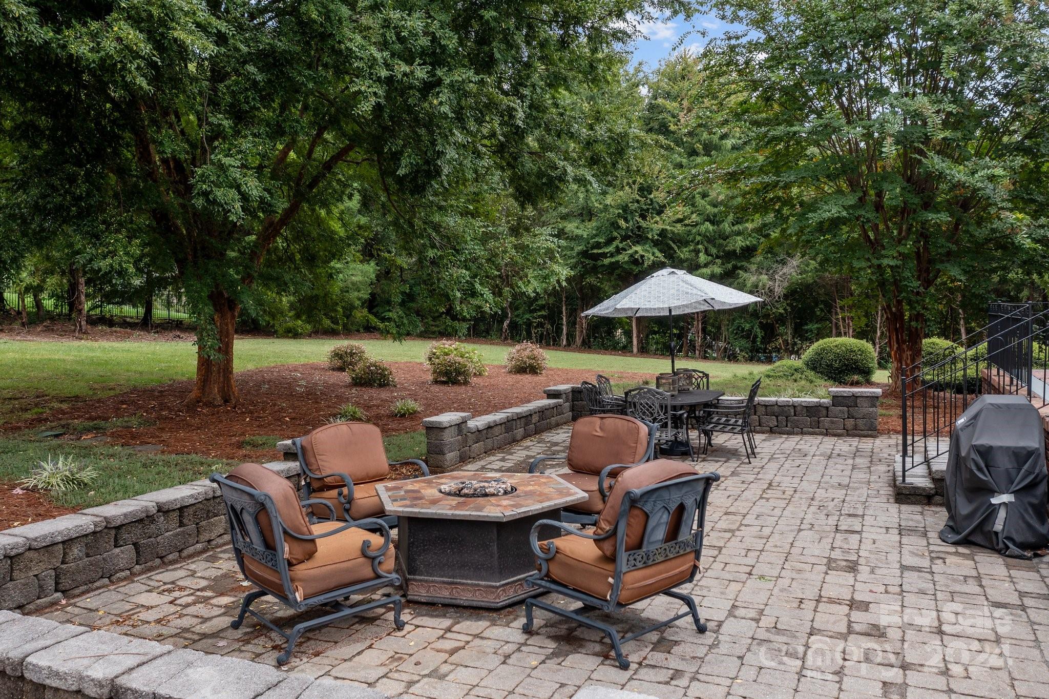6370 Chamar Circle Kannapolis, NC 28081 - Photo 40 of 48 a backyard of a house with table and chairs