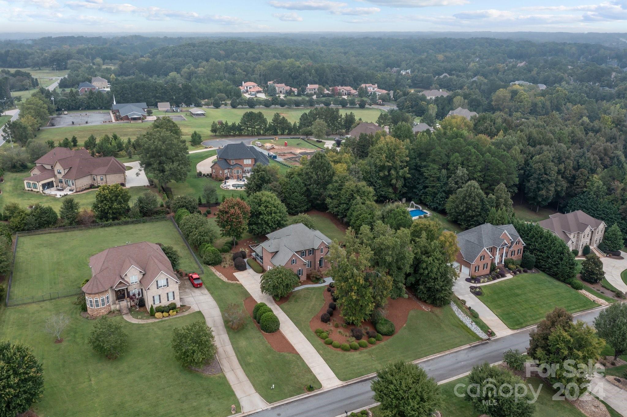 6370 Chamar Circle Kannapolis, NC 28081 - Photo 46 of 48 an aerial view of a house with a garden and lake view