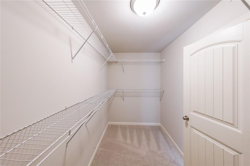 408 After Glow Summit Canton, GA 30114 - Photo 34 of 52 a view of a walk in closet