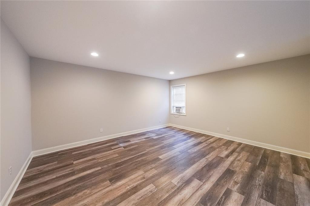 408 After Glow Summit Canton, GA 30114 - Photo 35 of 52 a view of room with wooden floor and window in a room