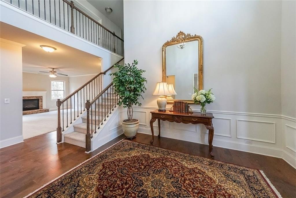 408 After Glow Summit Canton, GA 30114 - Photo 6 of 52 a living room with a bed furniture and wooden floor