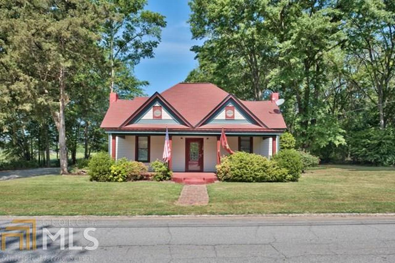 139 Hawkins Avenue Rutledge, GA 30663 - Photo 1 of 1 a front view of a house with a yard