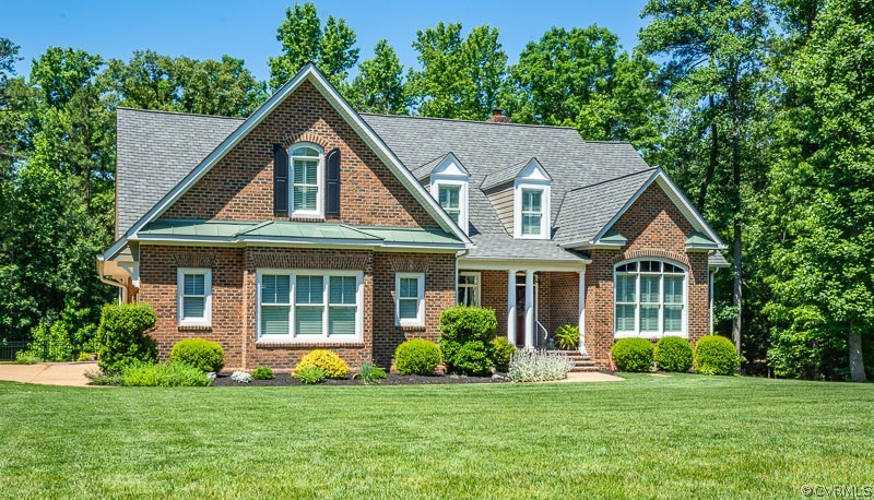 11624 Barrows Ridge Lane Chesterfield, VA 23838 - Photo 1 of 48 a house that is sitting in a big yard with large trees