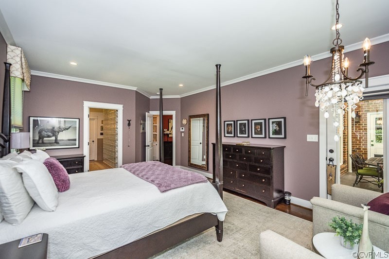 11624 Barrows Ridge Lane Chesterfield, VA 23838 - Photo 21 of 48 a spacious bedroom with a bed dresser and a flat screen tv
