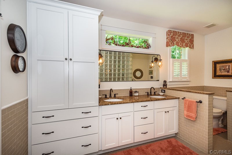 11624 Barrows Ridge Lane Chesterfield, VA 23838 - Photo 24 of 48 a bathroom with a double vanity sink and a window