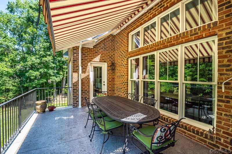11624 Barrows Ridge Lane Chesterfield, VA 23838 - Photo 39 of 48 a backyard of a house with table and chairs