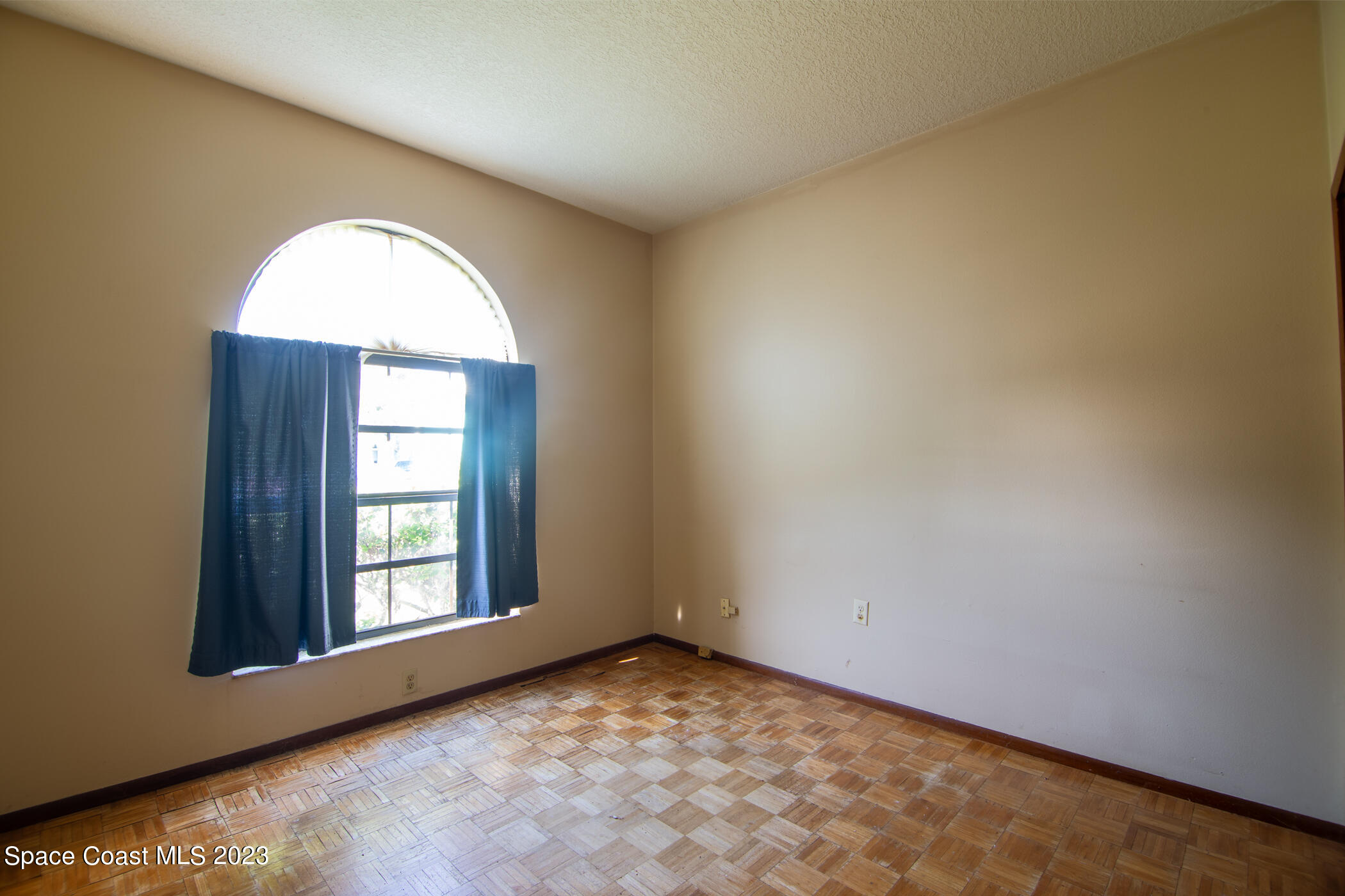 1816 Clover Circle Melbourne, FL 32935 - Photo 9 of 13 an empty room with windows