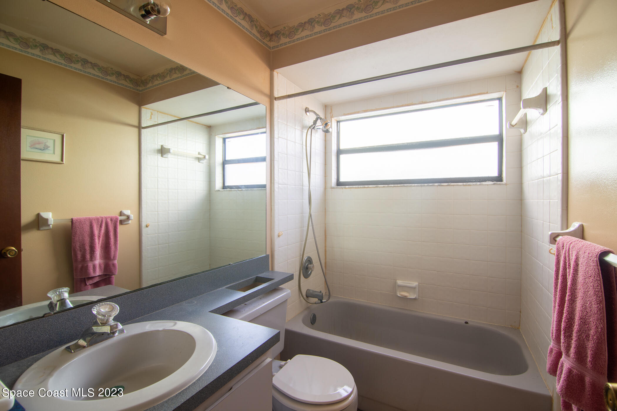 1816 Clover Circle Melbourne, FL 32935 - Photo 10 of 13 a bathroom with a sink toilet and shower