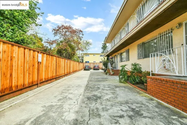 a view of a building with car parked