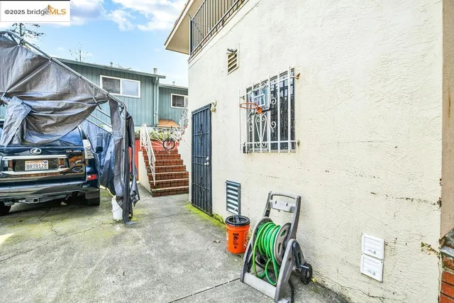 a view of a house with a park and wooden stairs