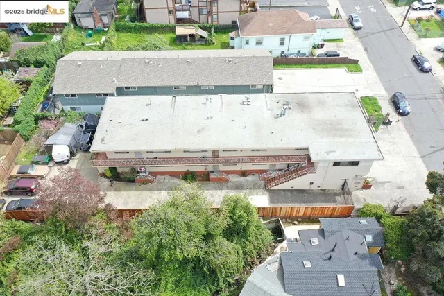 an aerial view of a house with yard swimming pool and outdoor seating
