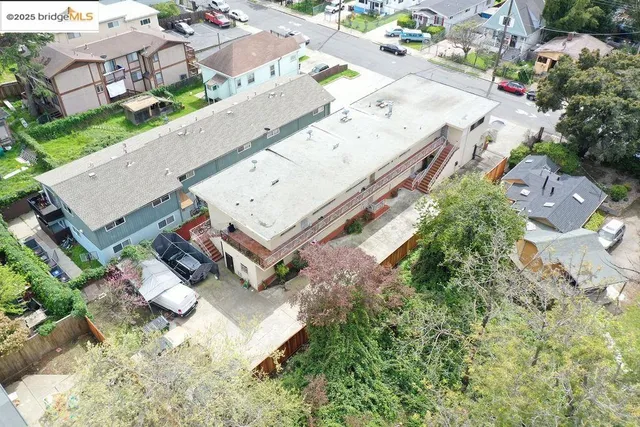 an aerial view of a house with a yard