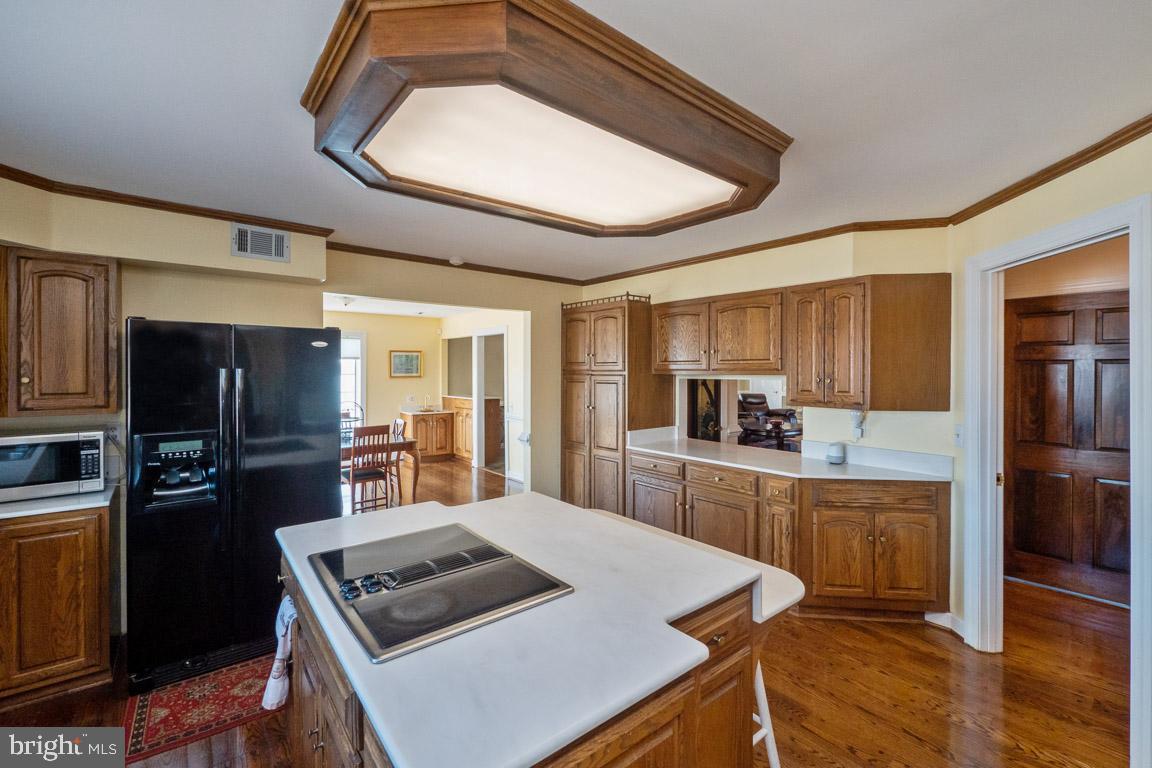 3100 Hemlock Point Court Triangle, VA 22172 - Photo 20 of 71 a kitchen with stainless steel appliances granite countertop a sink stove and refrigerator