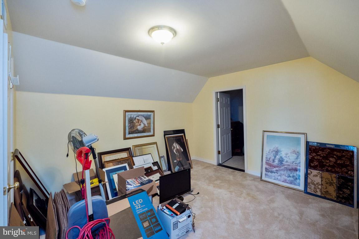 3100 Hemlock Point Court Triangle, VA 22172 - Photo 40 of 71 a room with furniture and a flat screen tv