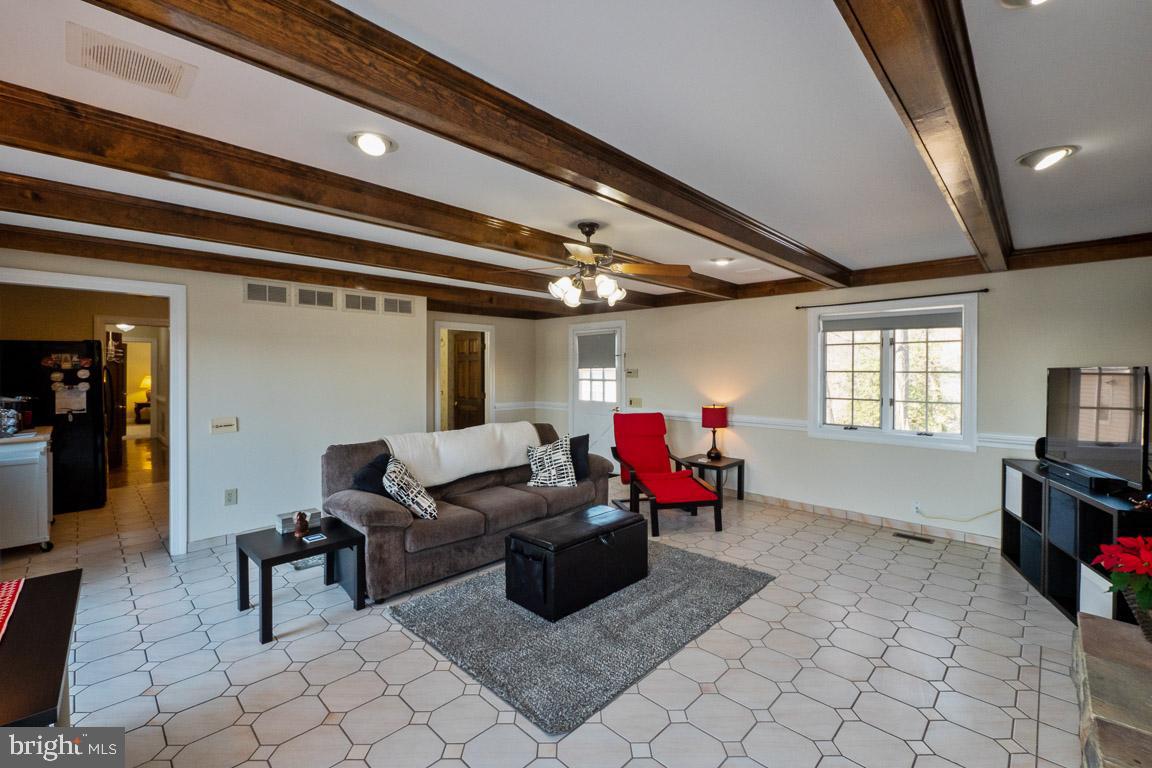 3100 Hemlock Point Court Triangle, VA 22172 - Photo 54 of 71 a living room with furniture a flat screen tv and a window