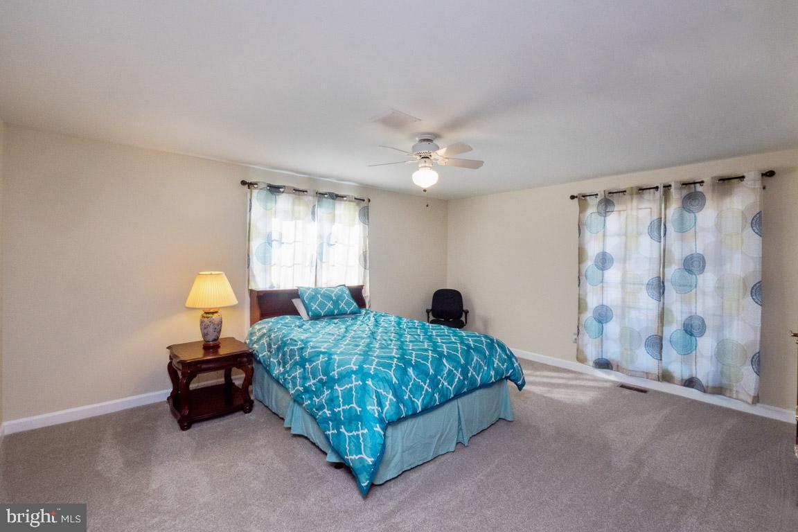 3100 Hemlock Point Court Triangle, VA 22172 - Photo 61 of 71 a bedroom with a bed and a window