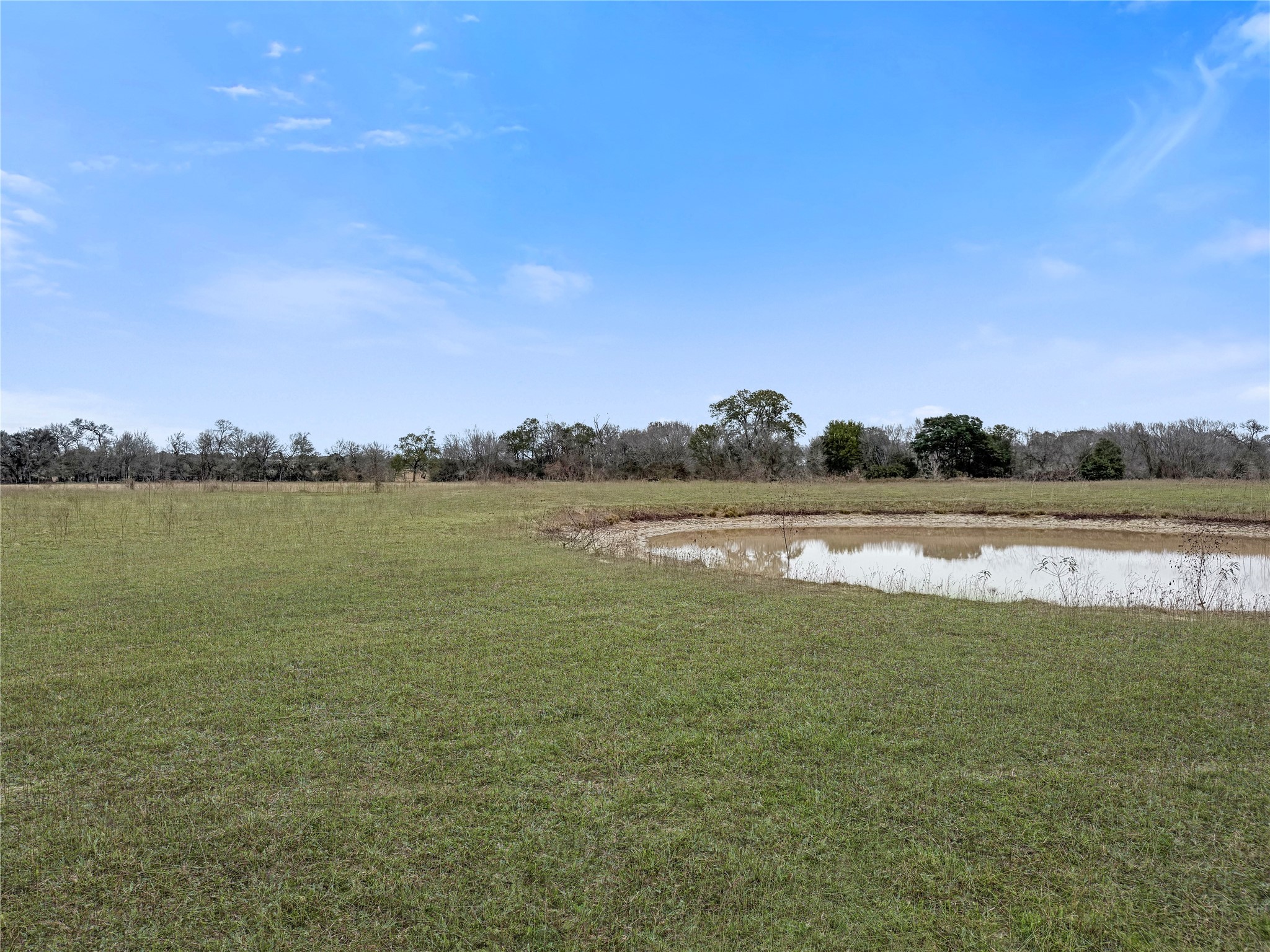 5885 Nickel Mica Road Flatonia, TX 78941 - Photo 11 of 12 a view of a lake with houses in the background