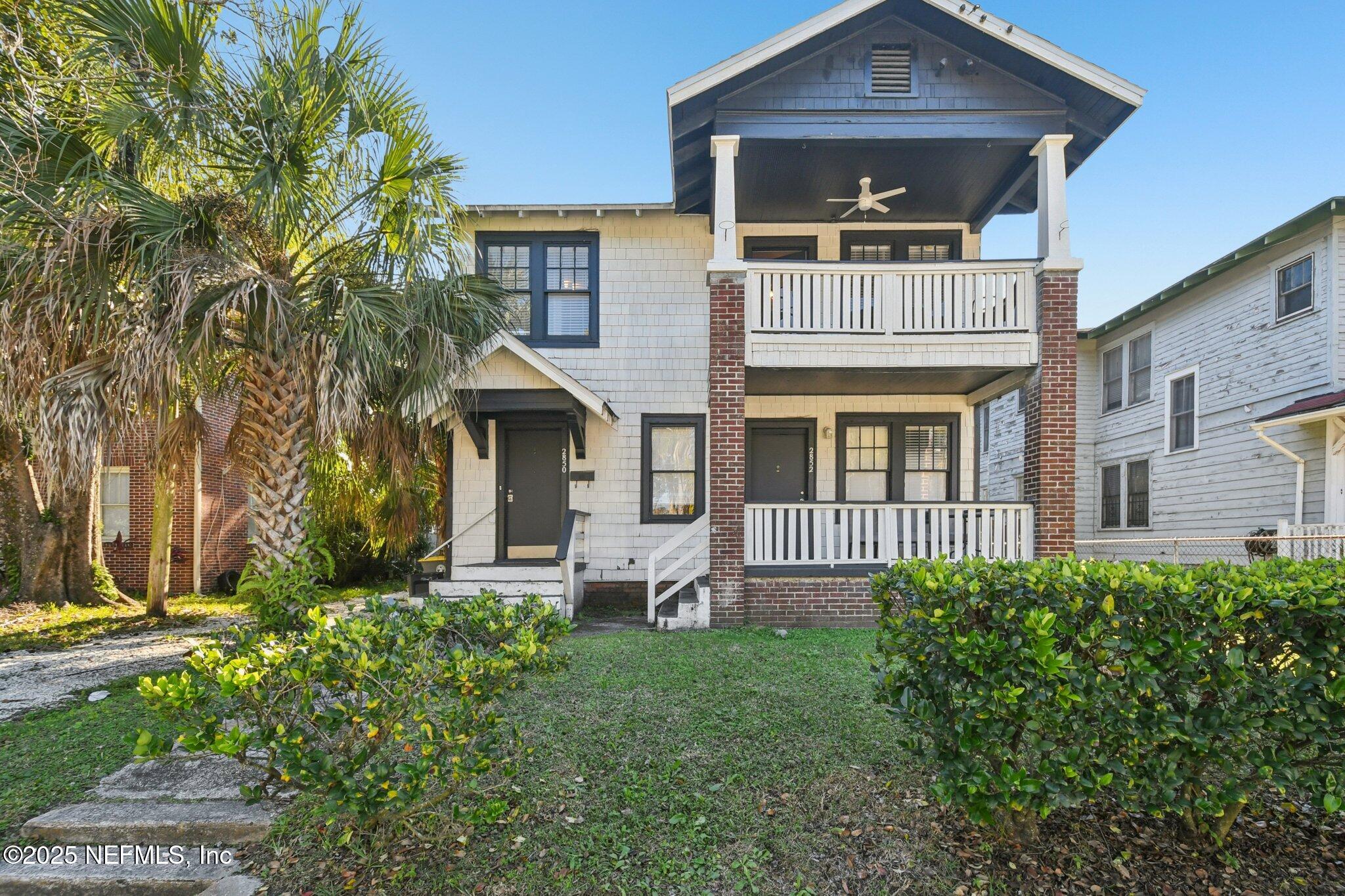 front view of a house with a yard