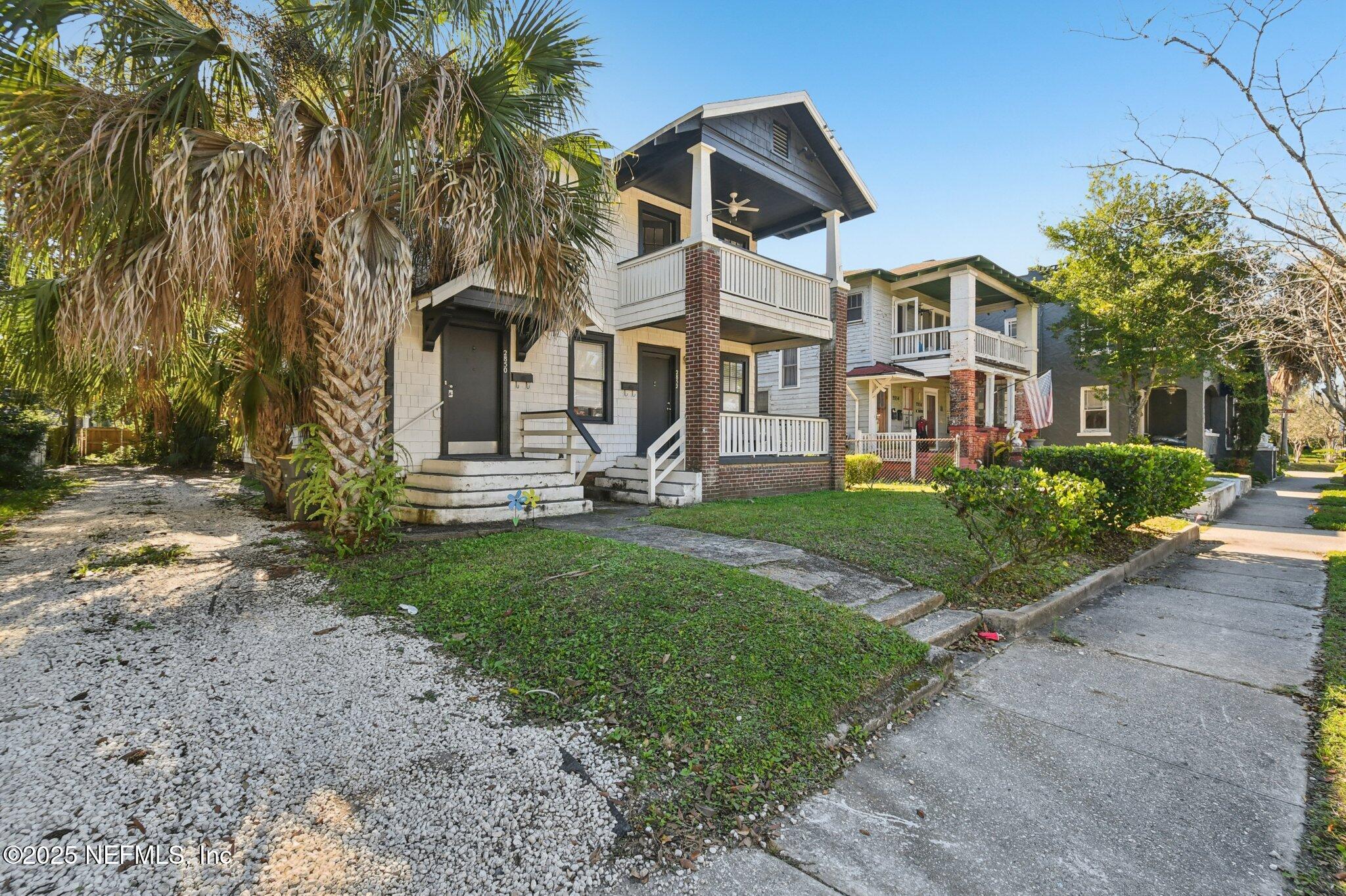 2850 College Street Jacksonville, FL 32205 - Photo 19 of 20 a view of a white house with a yard and plants