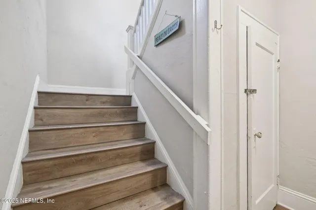 a view of staircase with white walls and white walls