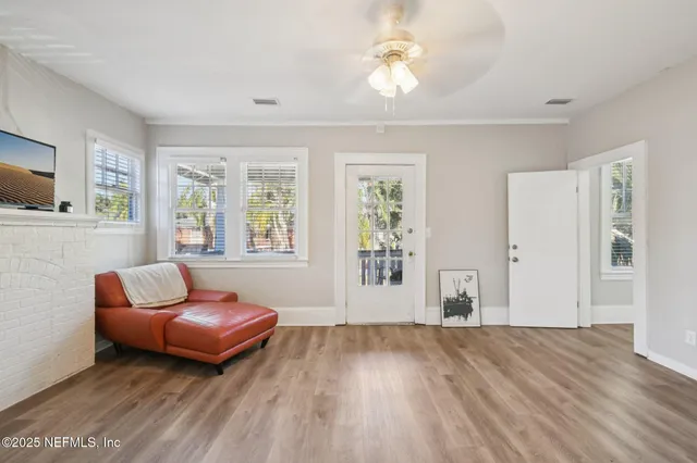 a living room with furniture and a window