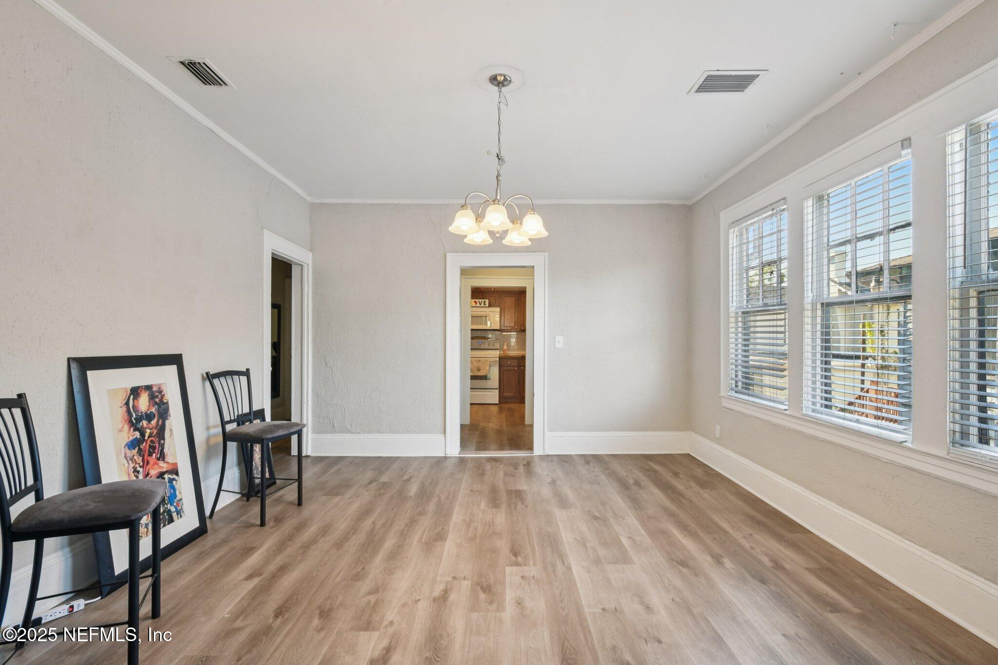 2850 College Street Jacksonville, FL 32205 - Photo 6 of 20 a view of empty room with wooden floor and fan