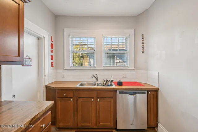 a bathroom with a sink and a window