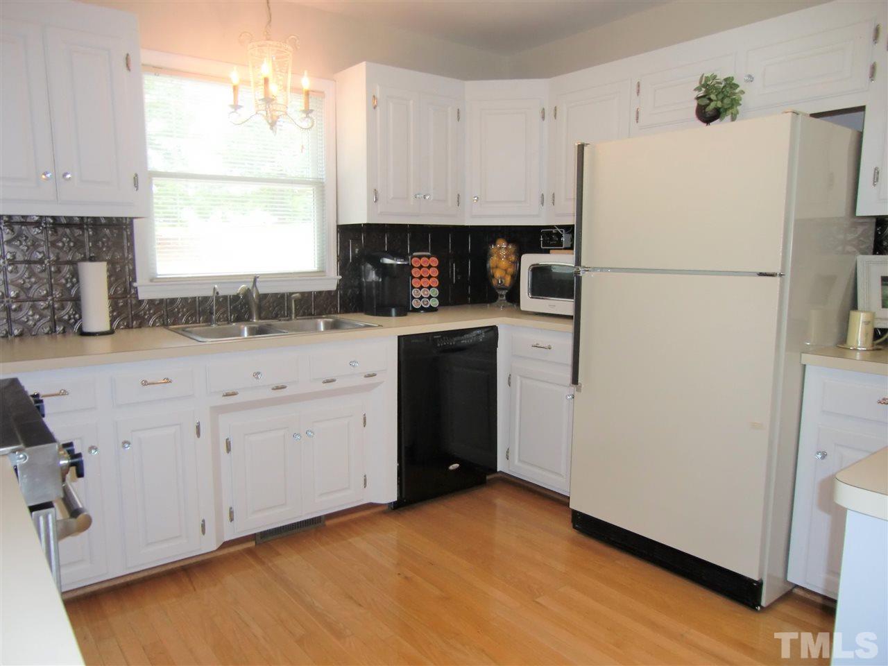 5348 Old Stage Road North Angier, NC 27501 - Photo 11 of 30 Seller is replacing dishwasher with a new stainless steel front, Drawer-Style Dishwasher. There is a filtered tap water dispenser at the sink.