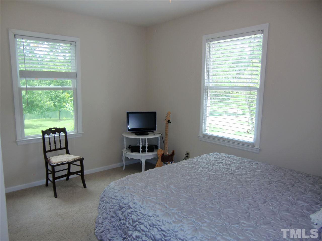 5348 Old Stage Road North Angier, NC 27501 - Photo 14 of 30 Bedroom 2 is on the 1ST Floor, has a large closet, and access to the Hall Full Bath.