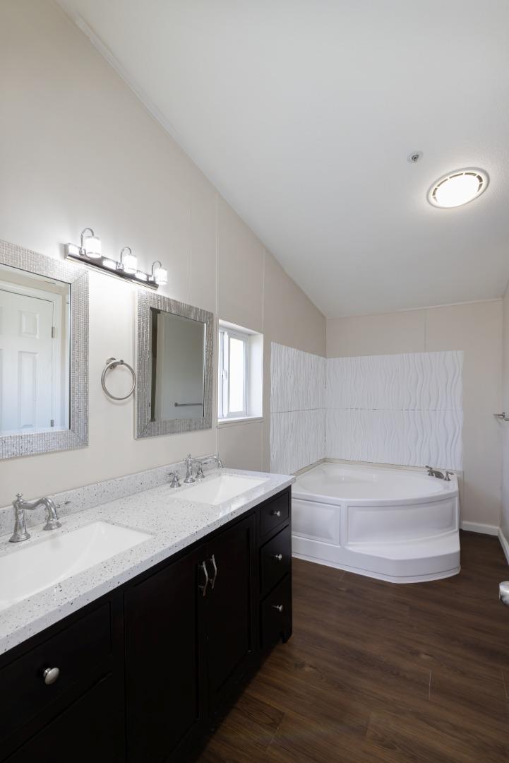 163 Harkins Slough Road Watsonville, CA 95076 - Photo 13 of 21 a bathroom with a sink double vanity granite and a mirror