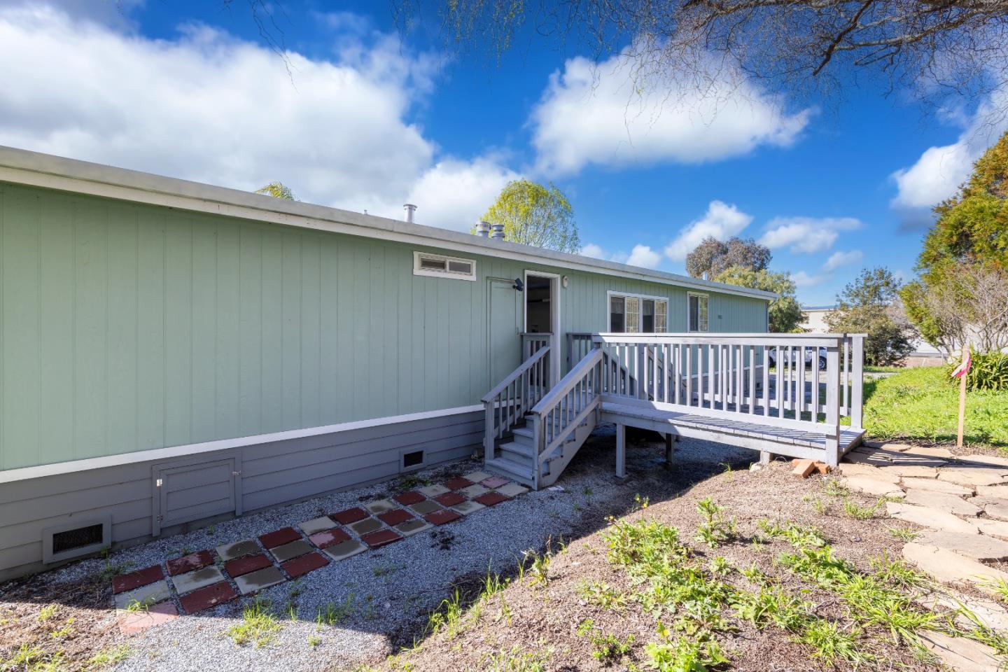 163 Harkins Slough Road Watsonville, CA 95076 - Photo 2 of 21 a balcony with hardwood