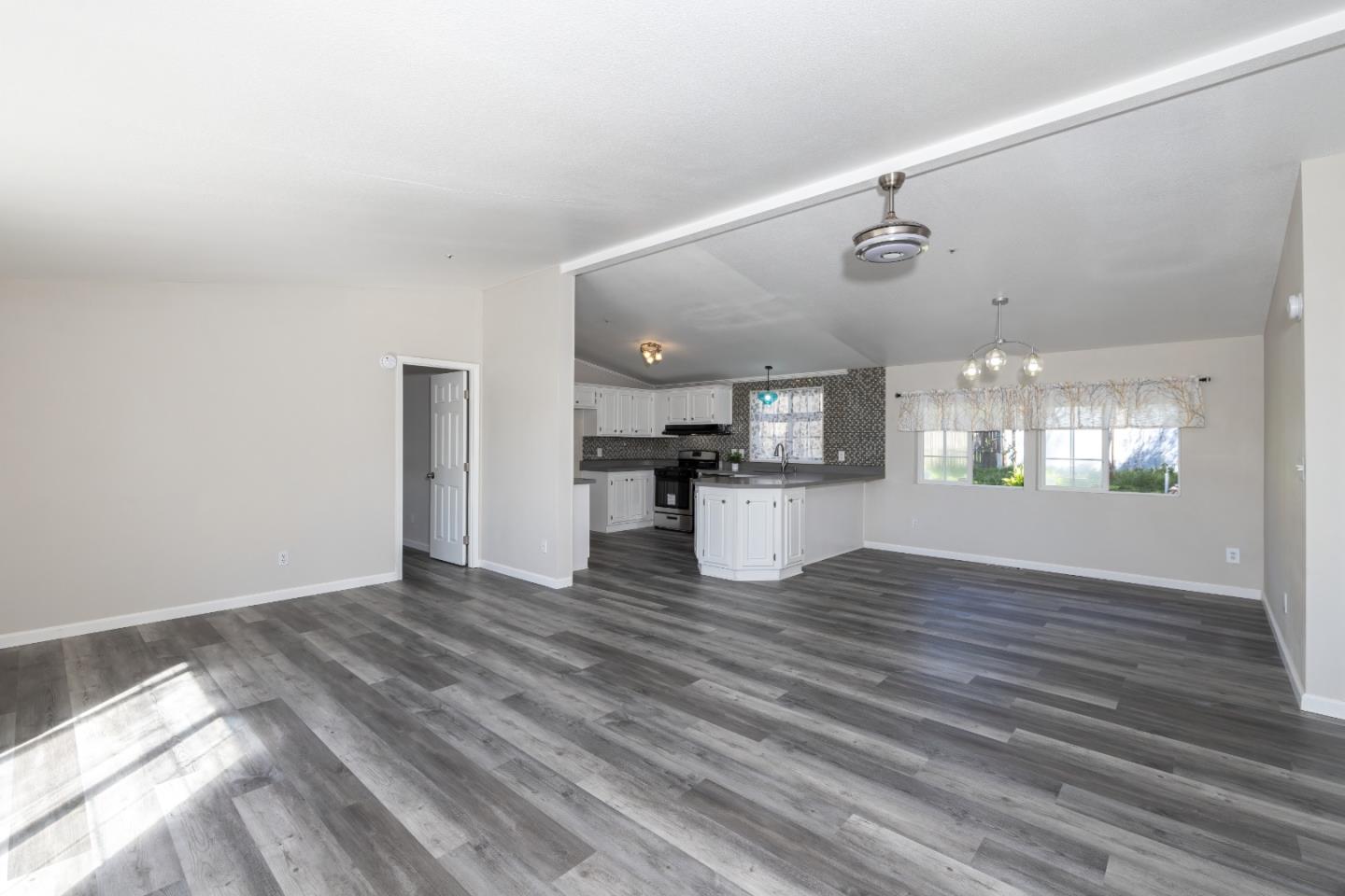 163 Harkins Slough Road Watsonville, CA 95076 - Photo 3 of 21 a view of kitchen with cabinets and wooden floor