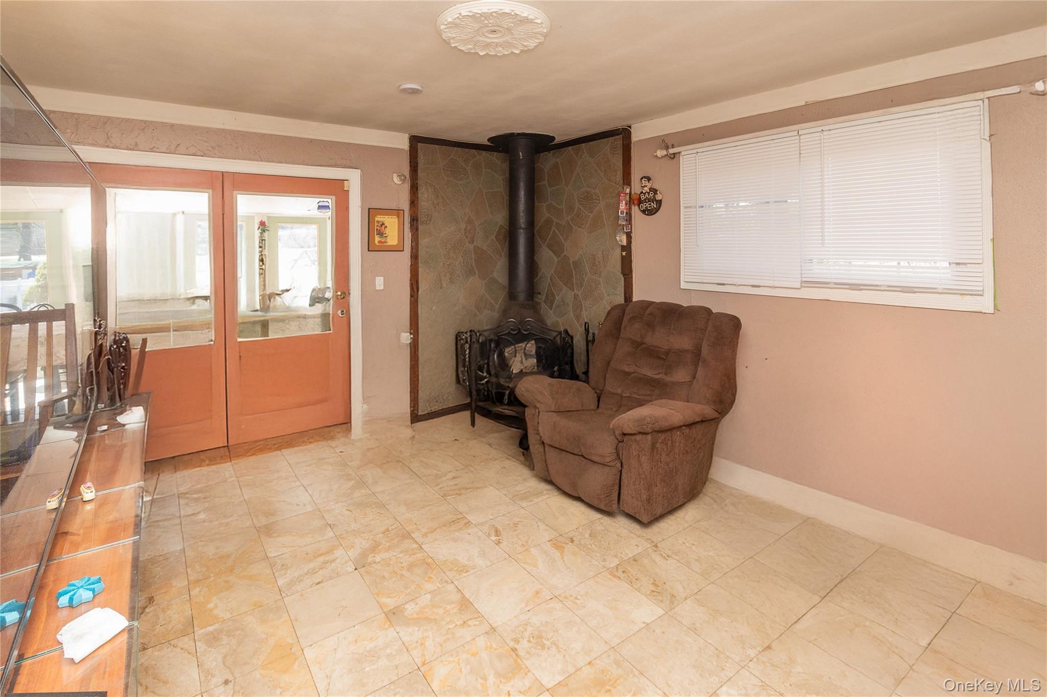 7 Merrick Lane Spring Valley, NY 10977 - Photo 14 of 28 a living room with furniture and a window