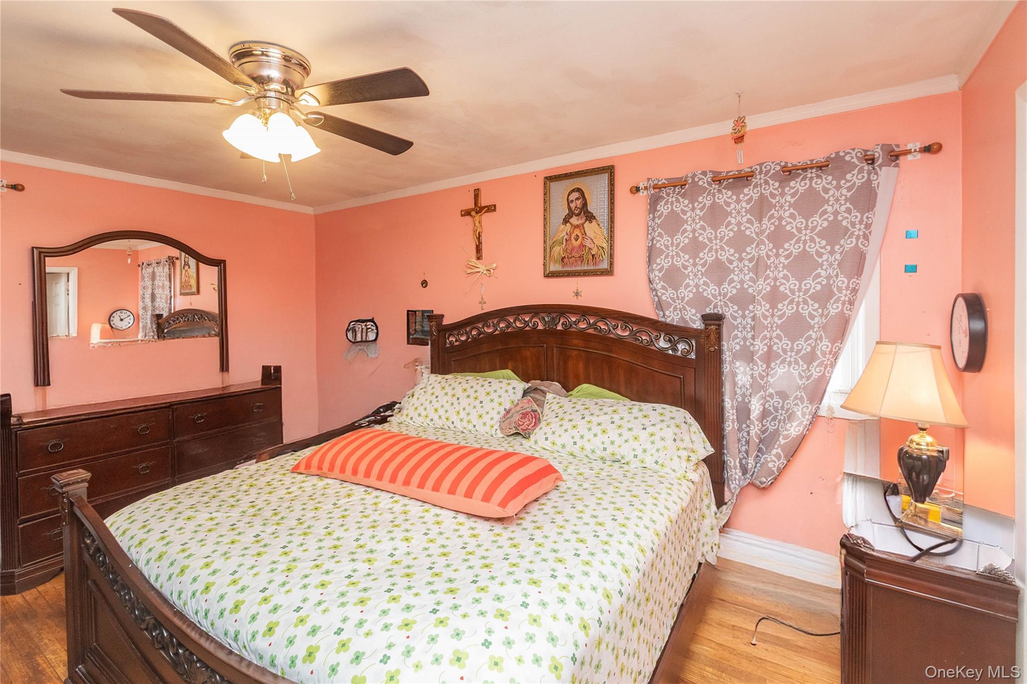 7 Merrick Lane Spring Valley, NY 10977 - Photo 19 of 28 a bedroom with a bed and dresser with mirror